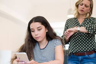 Teen girl with phone addiction ignoring her mother.