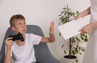 Boy addicted to gaming, refuses to read a book.