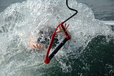 Rope being thrown to help drowning person.