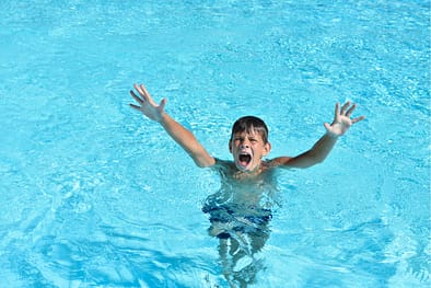 Boy drowns in the water in the pool or the sea and calls for help